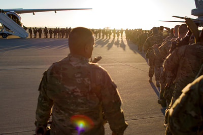 island soldier still, soldiers standing at sunset, line of soldiers, lineup, aircraft